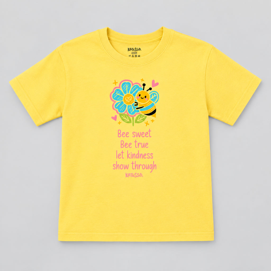 Yellow t-shirt with a bee and flower graphic and text on a gray background