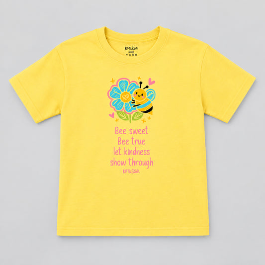 Yellow t-shirt with a bee and flower graphic and text on a gray background
